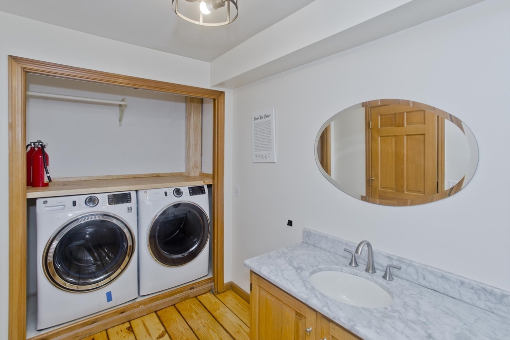 217 Inverness Lane Longmeadow, MA 01106 - Photo 23 of 42 a bathroom with a sink and a mirror