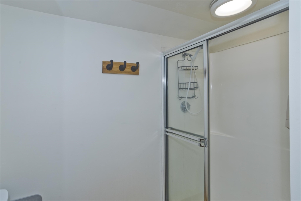 217 Inverness Lane Longmeadow, MA 01106 - Photo 26 of 42 a bathroom with a shower and a sink