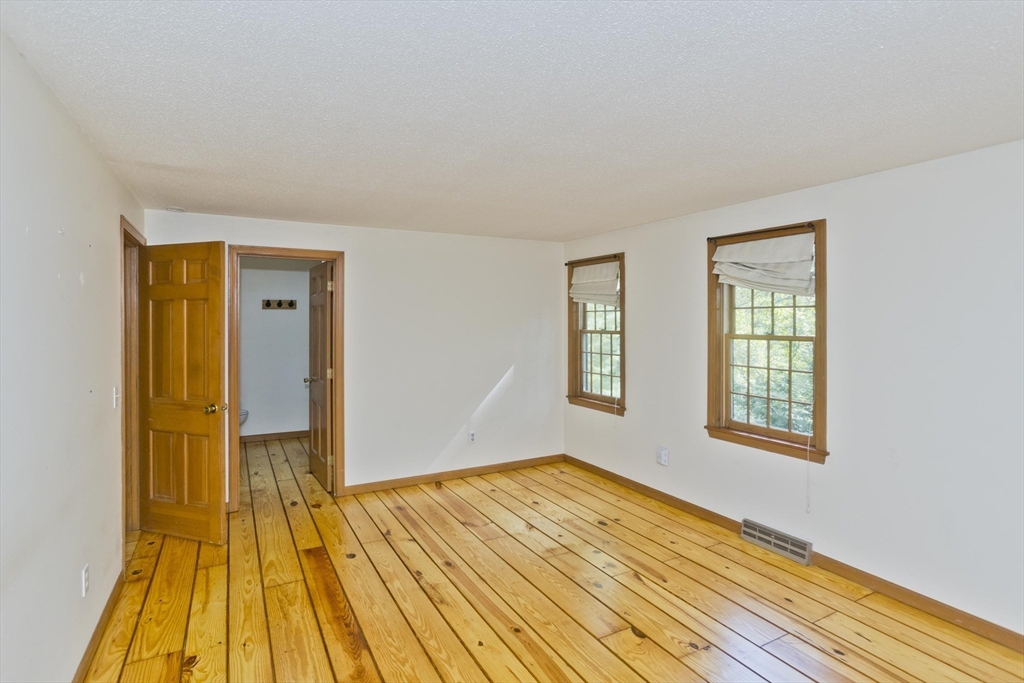217 Inverness Lane Longmeadow, MA 01106 - Photo 29 of 42 a view of a room with wooden floor and a window