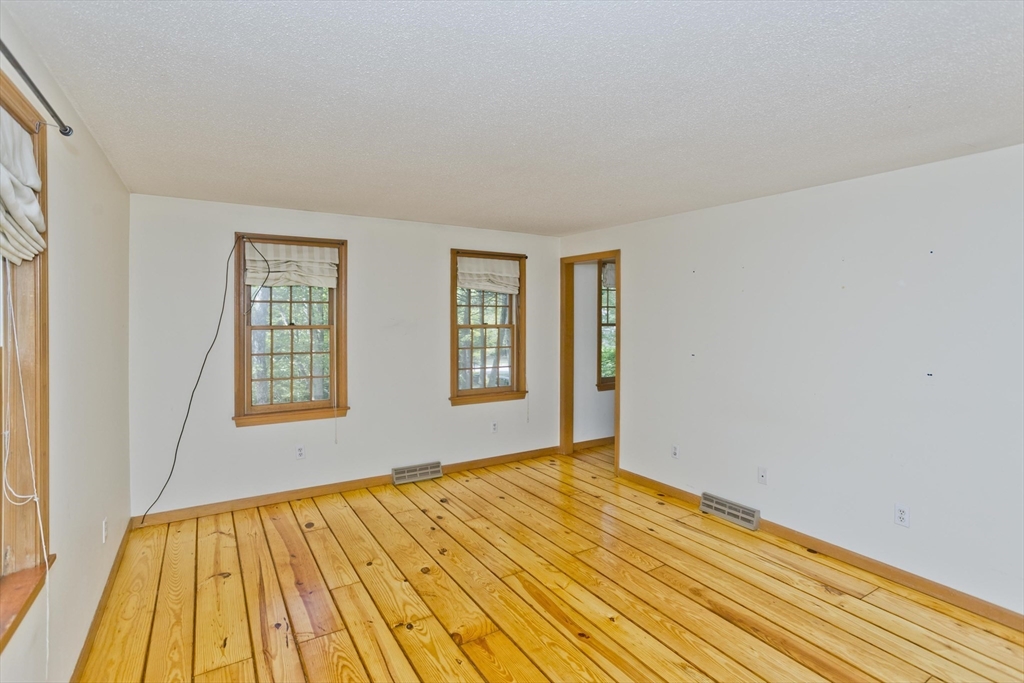 217 Inverness Lane Longmeadow, MA 01106 - Photo 30 of 42 a view of an empty room with wooden floor and a window