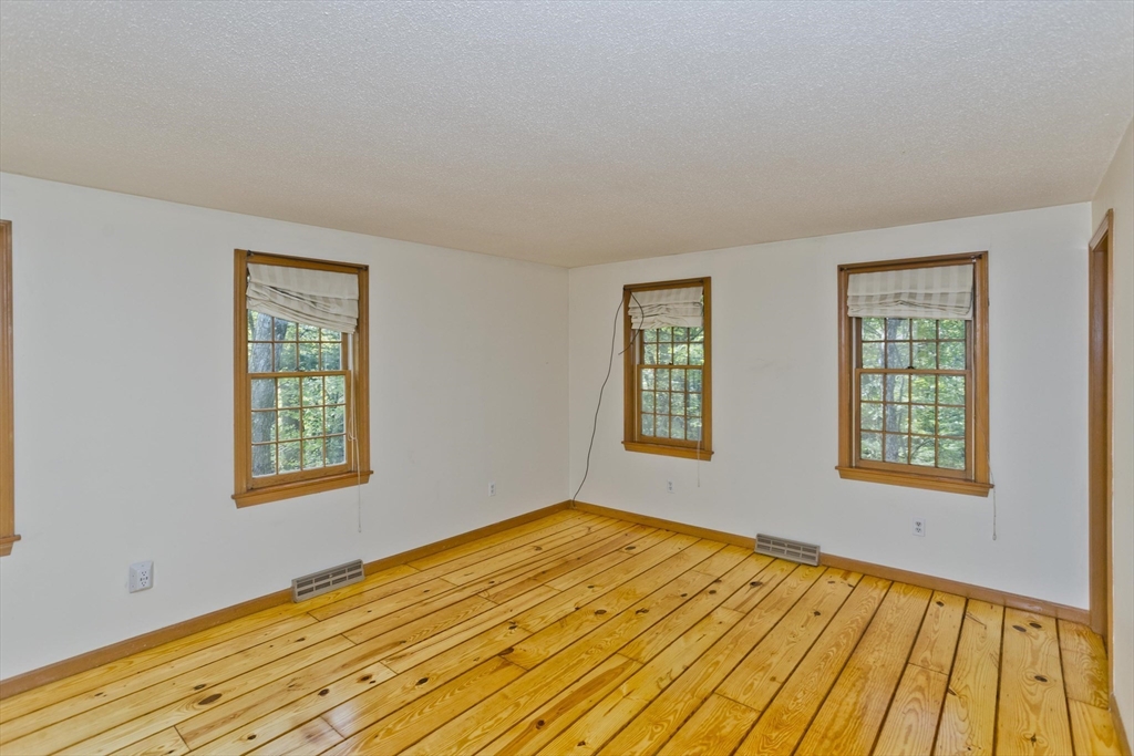 217 Inverness Lane Longmeadow, MA 01106 - Photo 31 of 42 a view of an empty room with wooden floor and a window