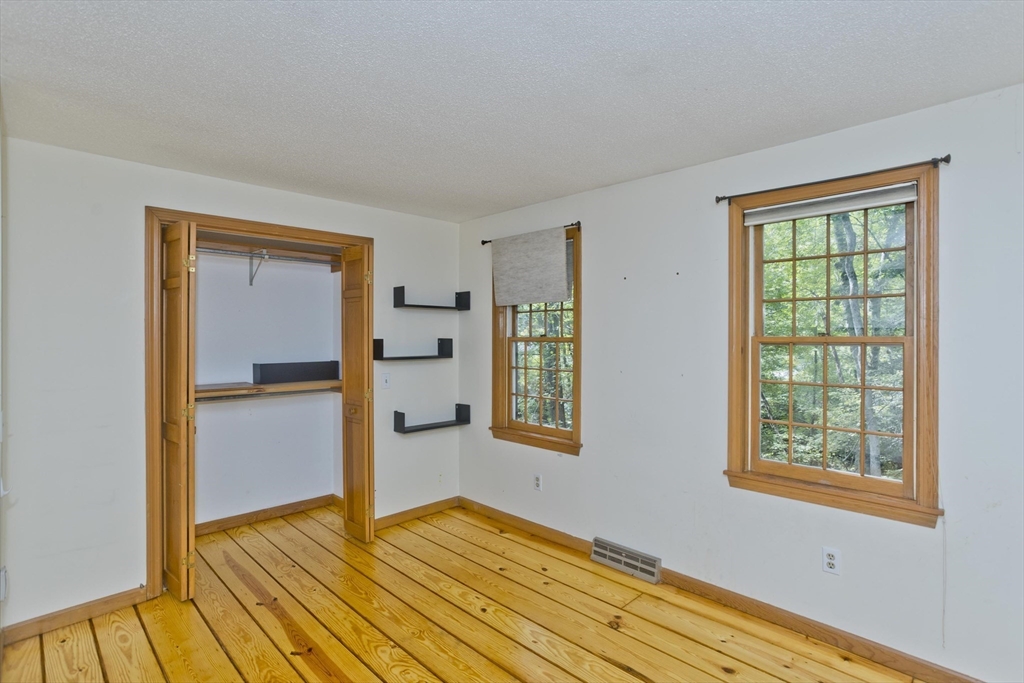 217 Inverness Lane Longmeadow, MA 01106 - Photo 33 of 42 a view of an empty room with window and wooden floor