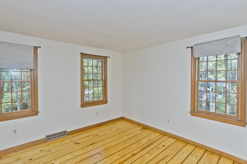 217 Inverness Lane Longmeadow, MA 01106 - Photo 34 of 42 a view of an empty room with wooden floor and a window