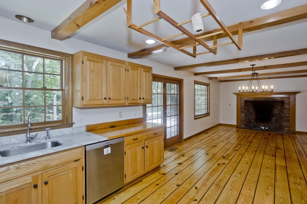 217 Inverness Lane Longmeadow, MA 01106 - Photo 7 of 42 a view of a kitchen with wooden floors and a sink