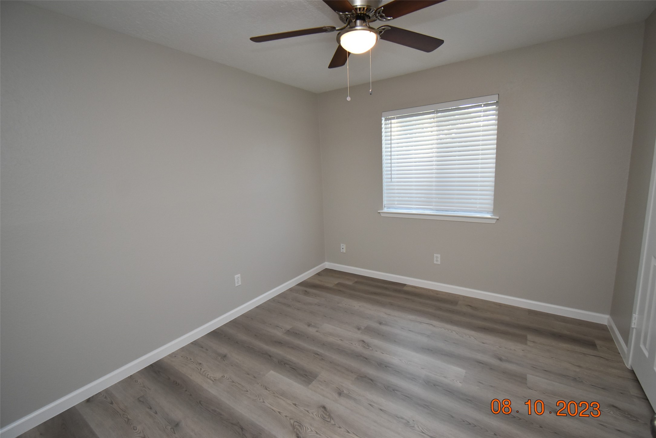 16702 Sheet Bend Way Friendswood, TX 77546 - Photo 12 of 22 an empty room with a window and a fan