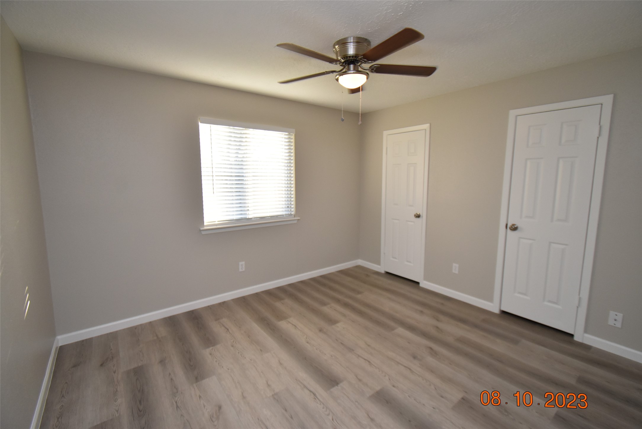 16702 Sheet Bend Way Friendswood, TX 77546 - Photo 13 of 22 an empty room with wooden floor and windows