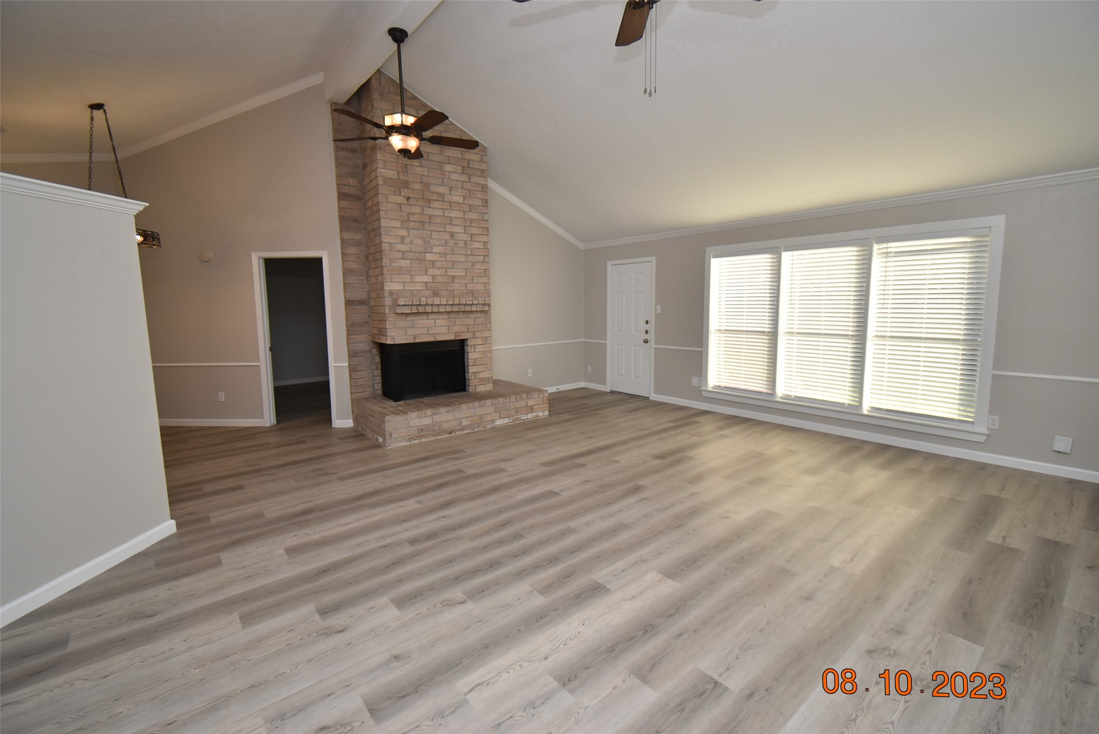 16702 Sheet Bend Way Friendswood, TX 77546 - Photo 2 of 22 wooden floor in an empty room with a fireplace