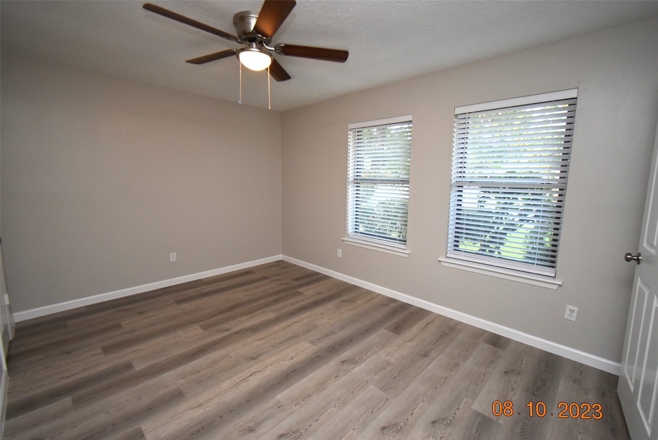 16702 Sheet Bend Way Friendswood, TX 77546 - Photo 7 of 22 a view of an empty room with window and chandelier fan