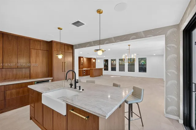 a kitchen with a stove and a refrigerator
