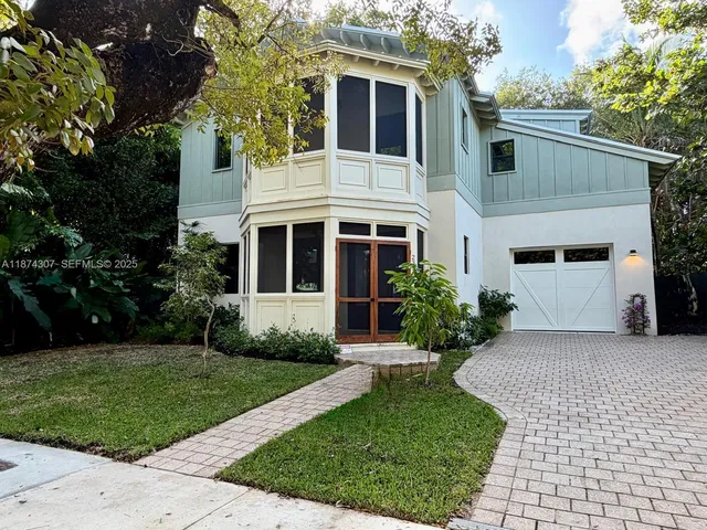 a front view of a house with yard