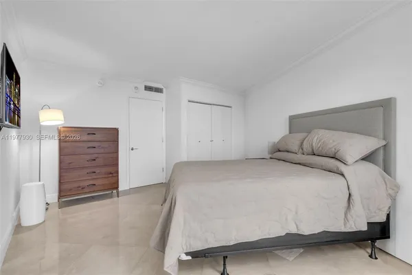 a bedroom with a bed and furniture