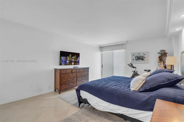 a bedroom with a bed and a cabinets