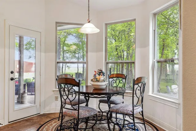 a dining room with furniture window wooden floor