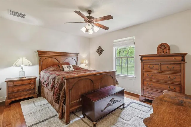 a bedroom with a bed and window