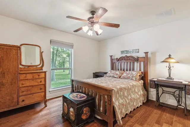 a bedroom with a bed and a table