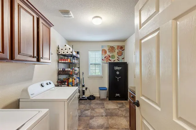a living room with furniture a window and a chandelier