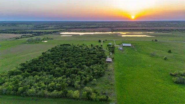 a view of an ocean and a yard
