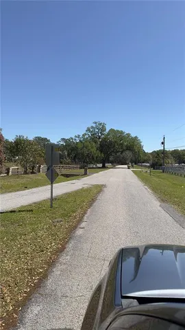 a view of a lake with a yard