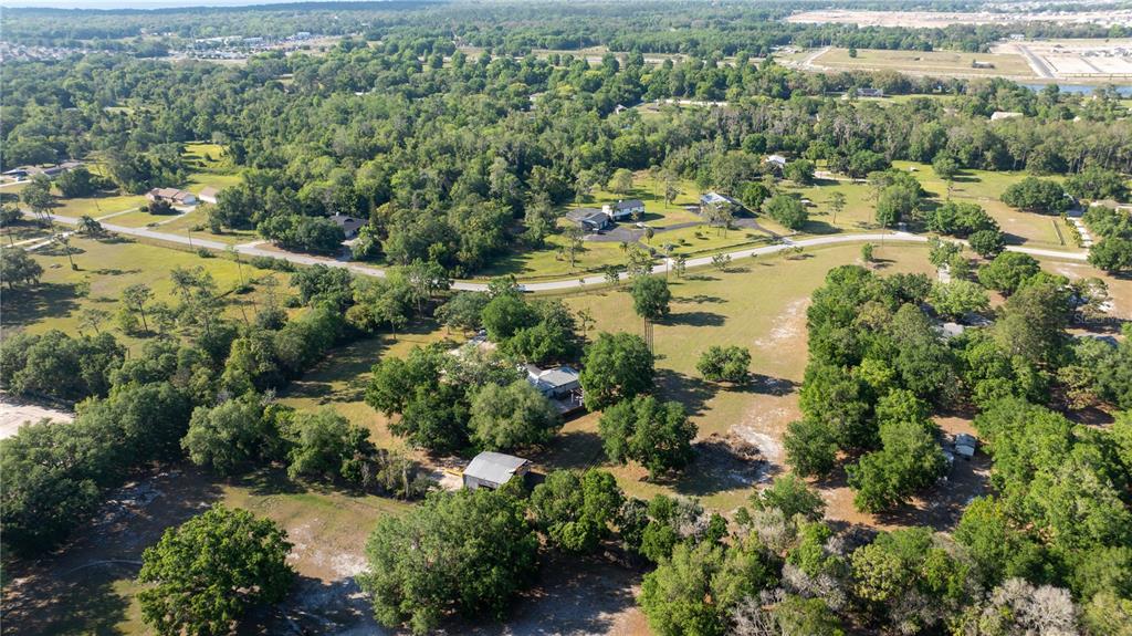 0 Haywood Ruffin Road St. Cloud, FL 34771 - Photo 17 of 23 an aerial view of residential house with outdoor space and trees all around
