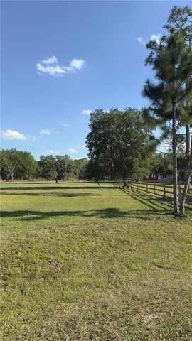 a view of a golf course with a lake