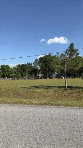 a view of a lake with a yard