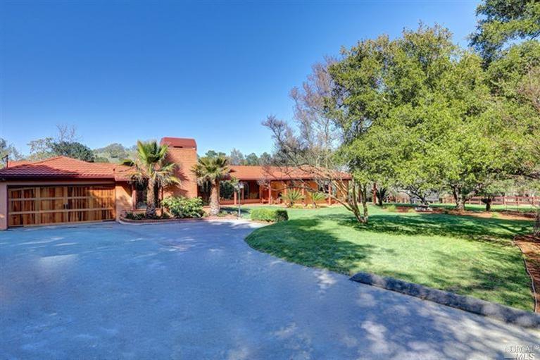 42 Oak Ridge Road San Rafael, CA 94903 - Photo 1 of 1 a view of a house with a yard and potted plants