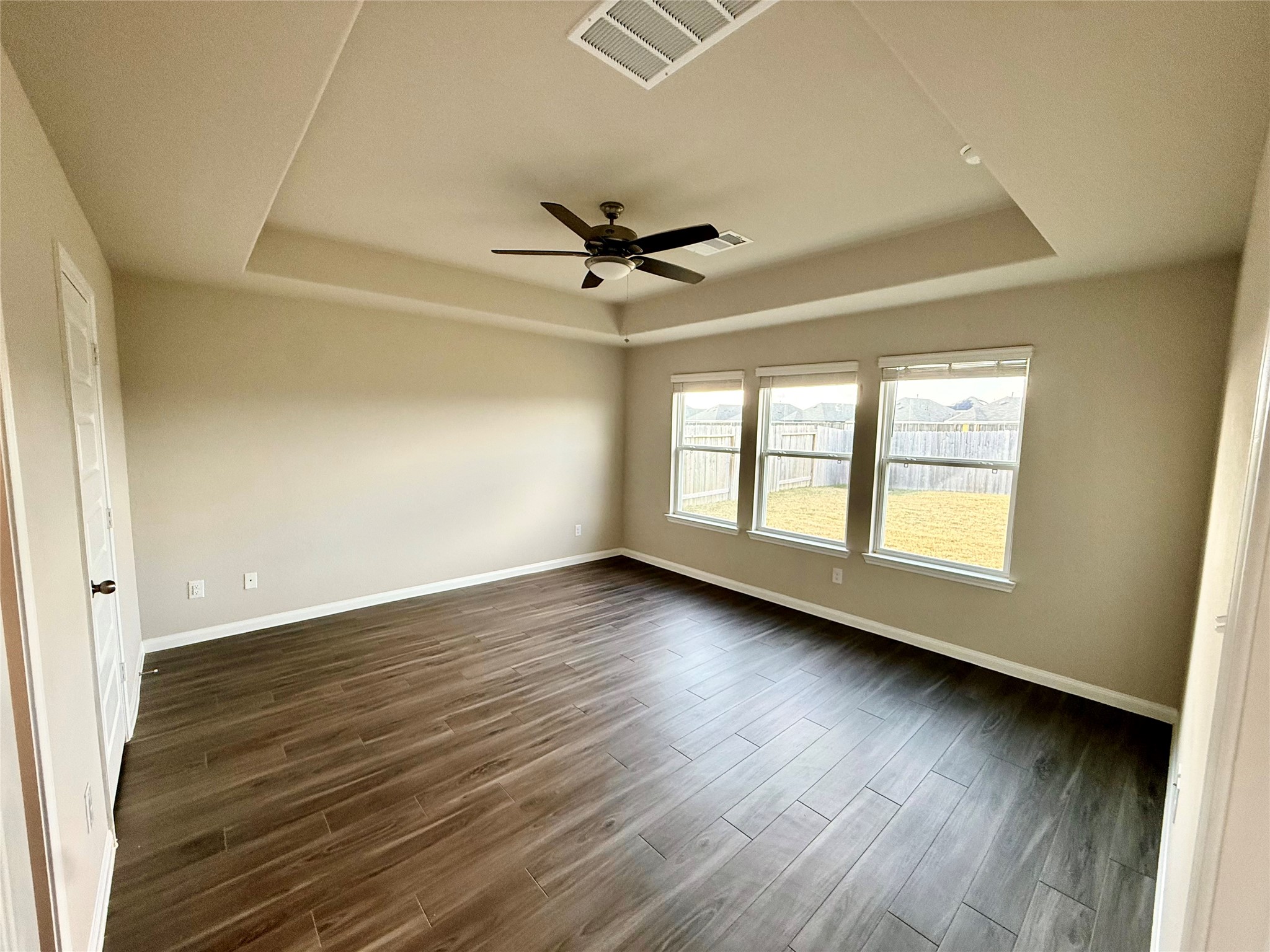 5322 Briana Dee Drive Rosharon, TX 77583 - Photo 12 of 20 an empty room with wooden floor and windows