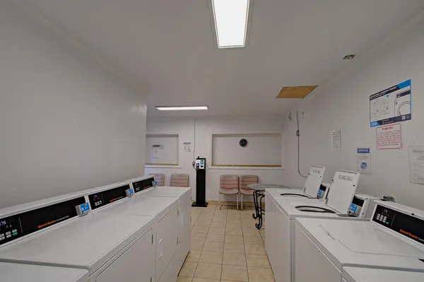 a view of a kitchen with a sink stainless steel appliances and cabinets