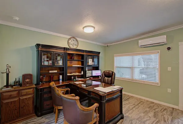 a work room with furniture and window
