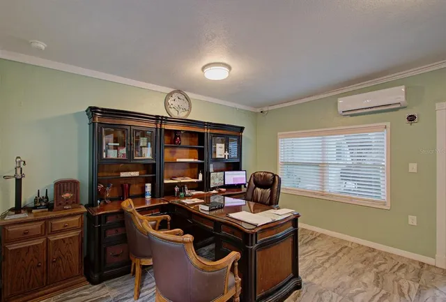 a work room with furniture and window
