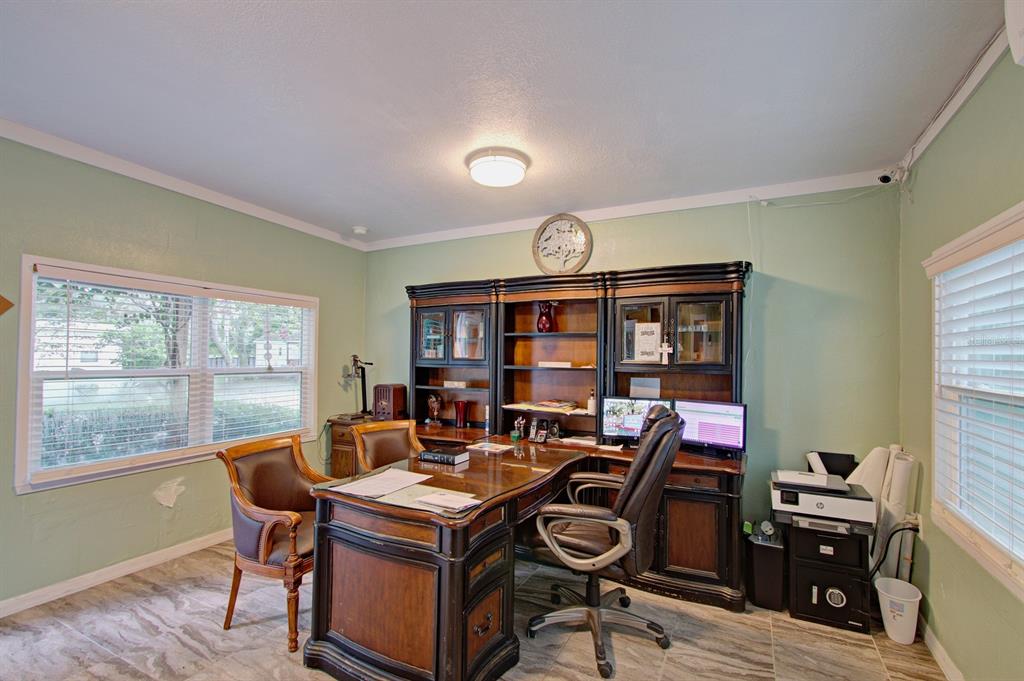 28313 Highway 27 Leesburg, FL 34748 - Photo 25 of 46 a view of a workspace with furniture and a window