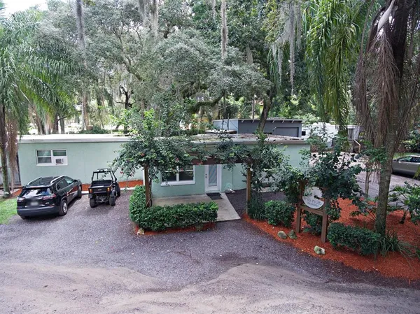 a view of a back yard of the house