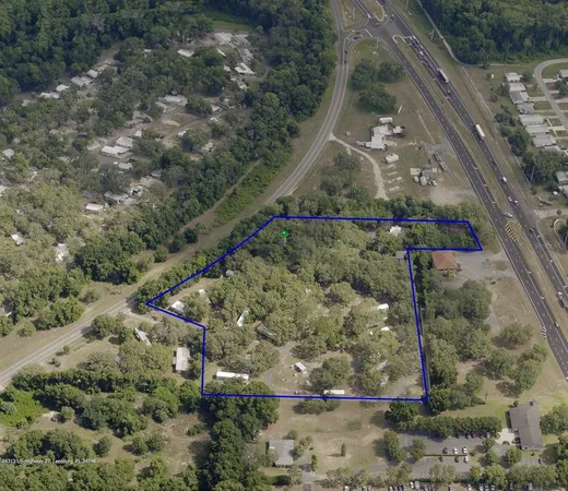 a aerial view of a house with a yard