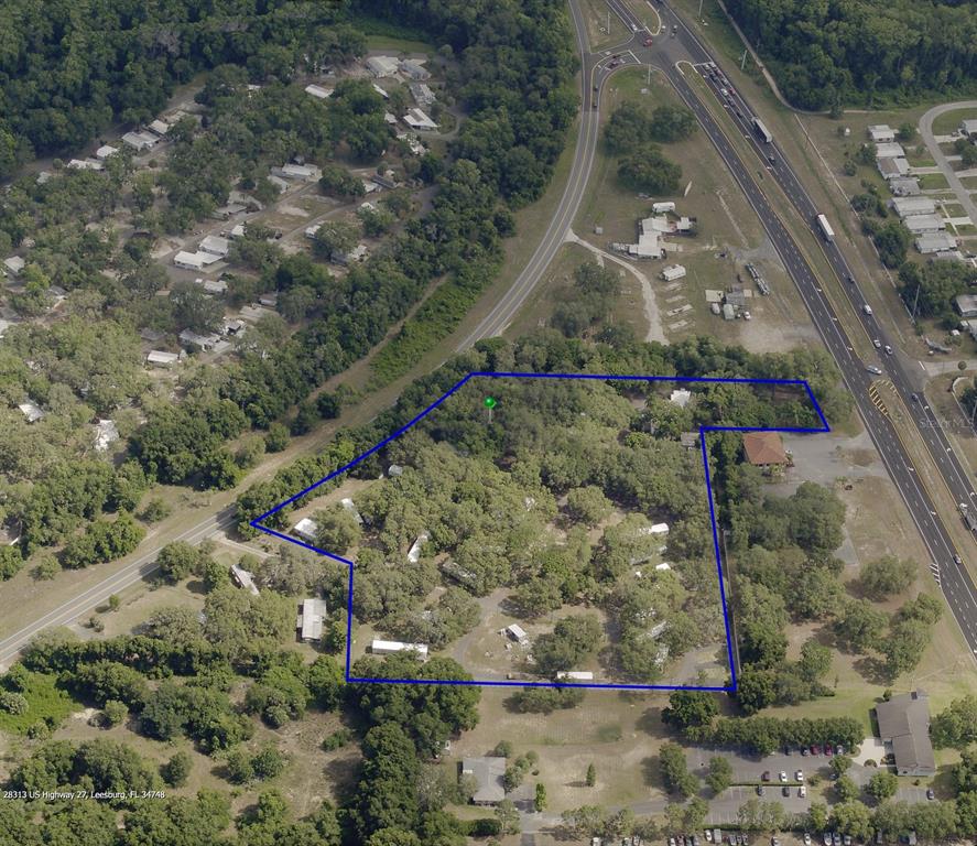 28313 Highway 27 Leesburg, FL 34748 - Photo 44 of 46 a aerial view of a house with a yard