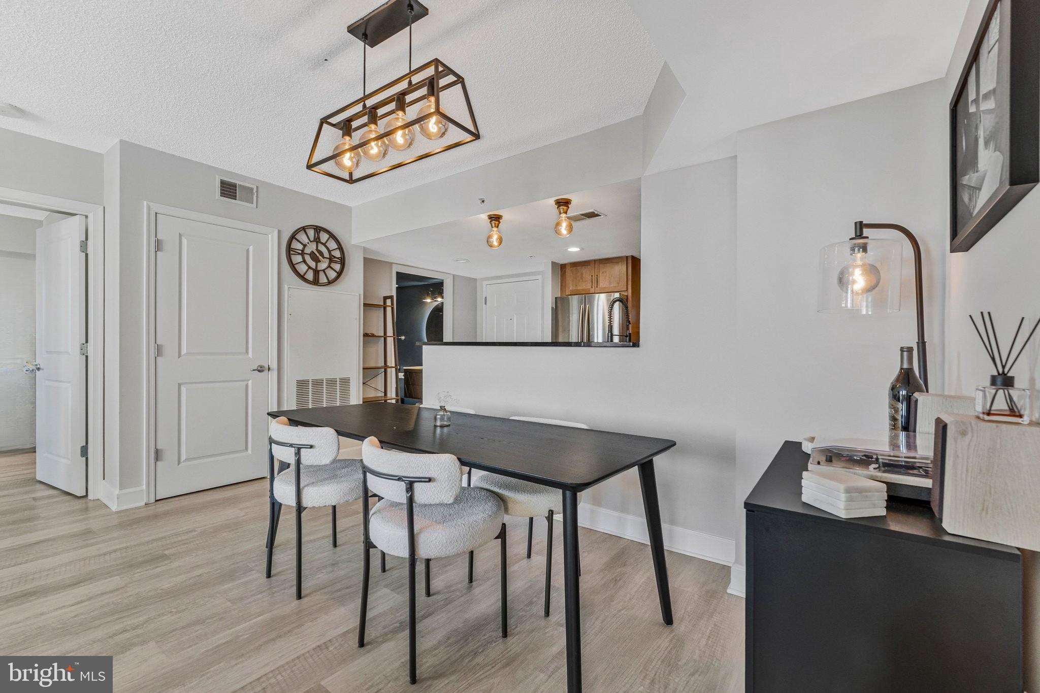 11800 Sunset Hills Road, Unit 826 Reston, VA 20190 - Photo 4 of 61 Dining area with modern fixtures