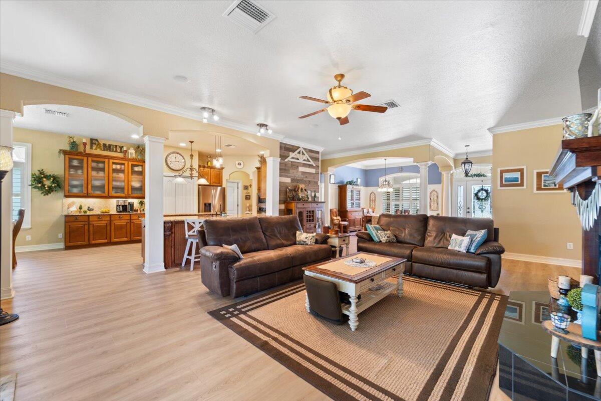 3260 Quantum Place Mims, FL 32754 - Photo 11 of 30 a living room with furniture and wooden floor
