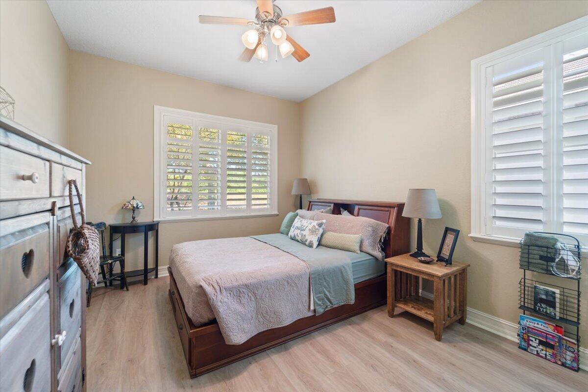 3260 Quantum Place Mims, FL 32754 - Photo 24 of 30 a bedroom with a bed and a window