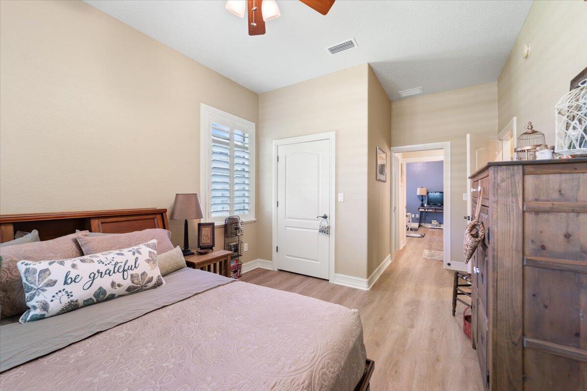 3260 Quantum Place Mims, FL 32754 - Photo 25 of 30 a bedroom with a bed and a couch