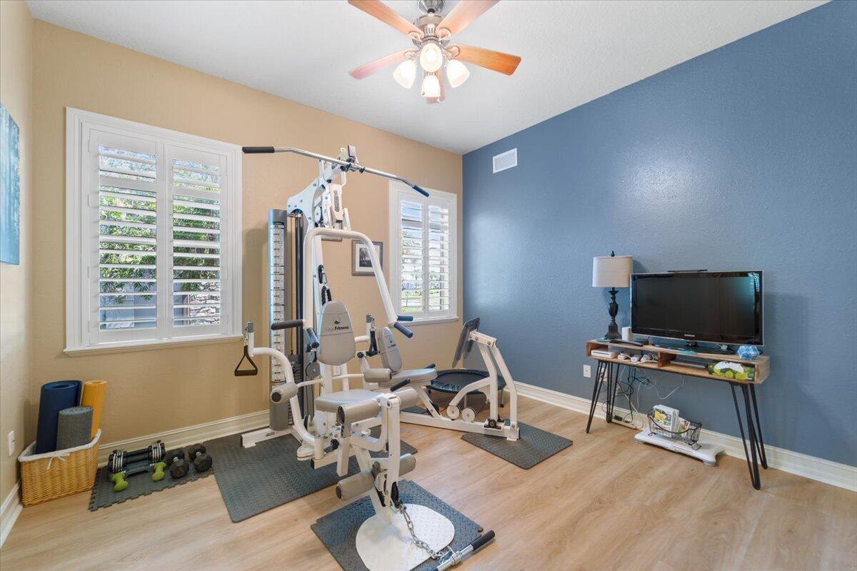3260 Quantum Place Mims, FL 32754 - Photo 27 of 30 a work room with furniture a rug and a window
