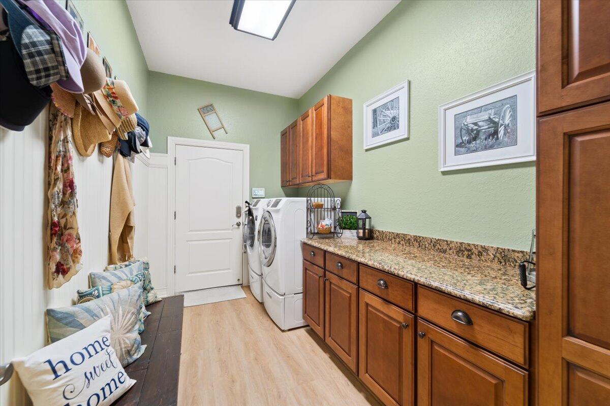 3260 Quantum Place Mims, FL 32754 - Photo 29 of 30 a utility room with a sink a washer and dryer