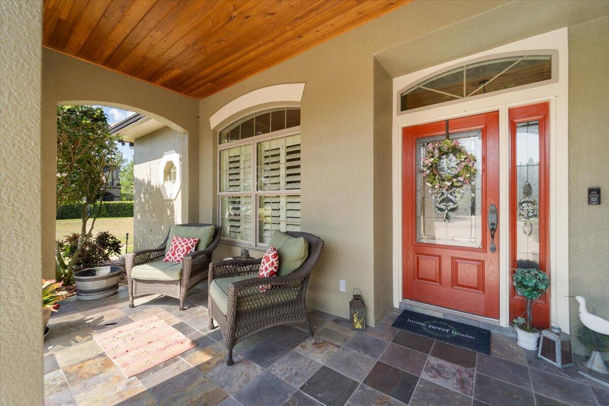 3260 Quantum Place Mims, FL 32754 - Photo 5 of 30 a living room with furniture and floor to ceiling windows