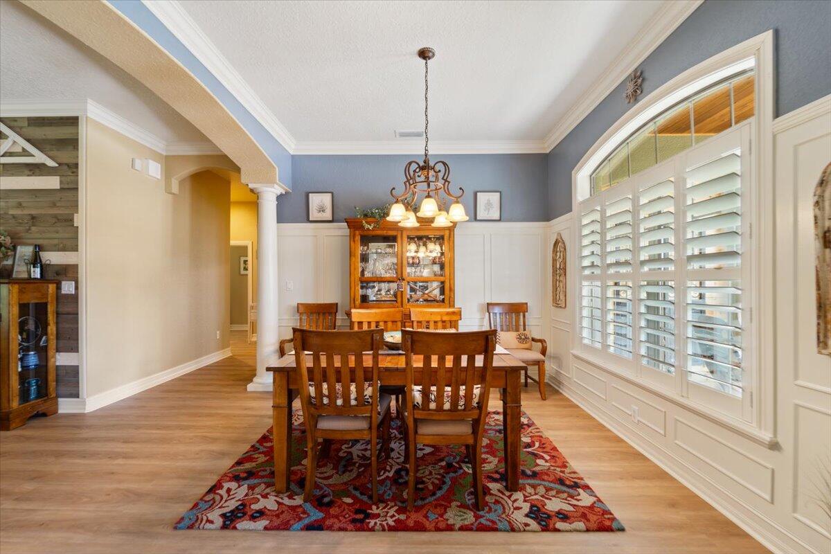 3260 Quantum Place Mims, FL 32754 - Photo 6 of 30 a view of a dining room with furniture window and wooden floor