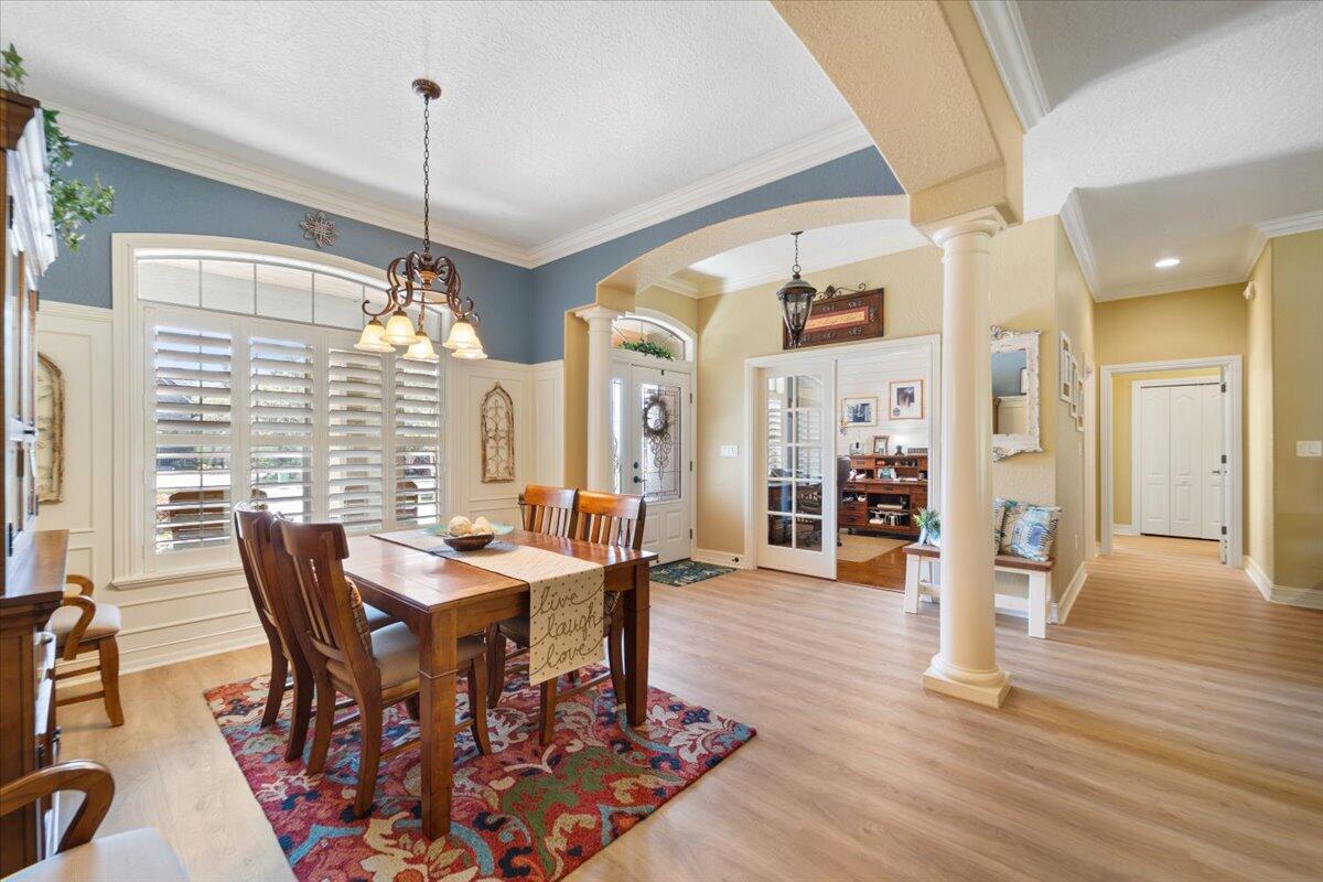 3260 Quantum Place Mims, FL 32754 - Photo 7 of 30 a view of a dining room with furniture window and wooden floor