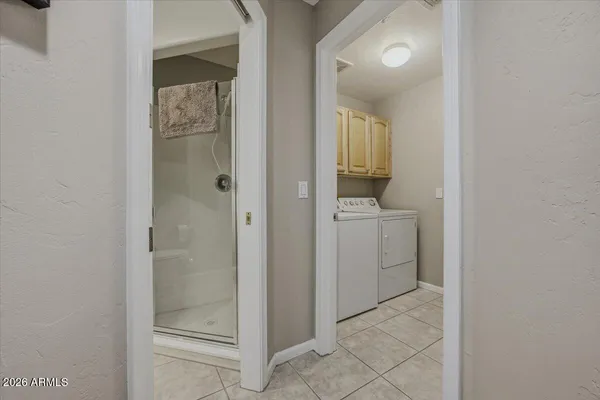 a living room with furniture and a red umbrella