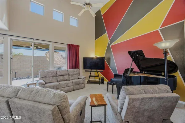 a view of a workspace with furniture and closet
