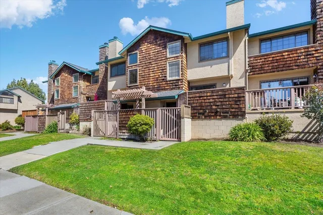 a front view of a house with a yard and porch