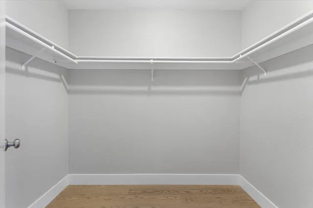 a view of an empty walk in closet