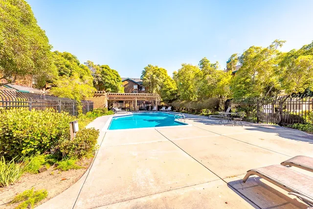 a view of yard with large trees
