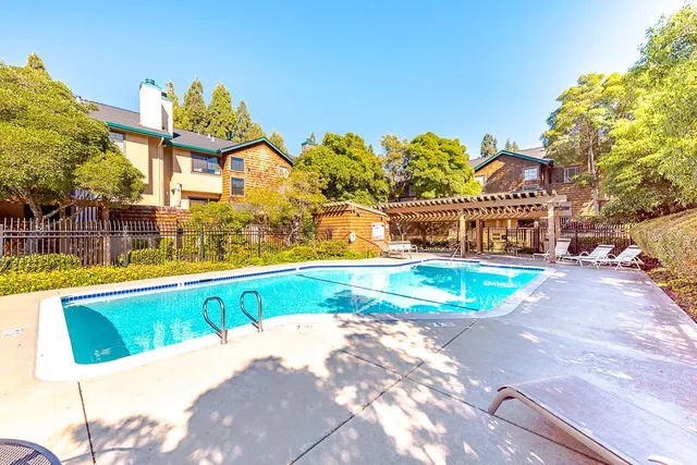 a view of a swimming pool with a patio