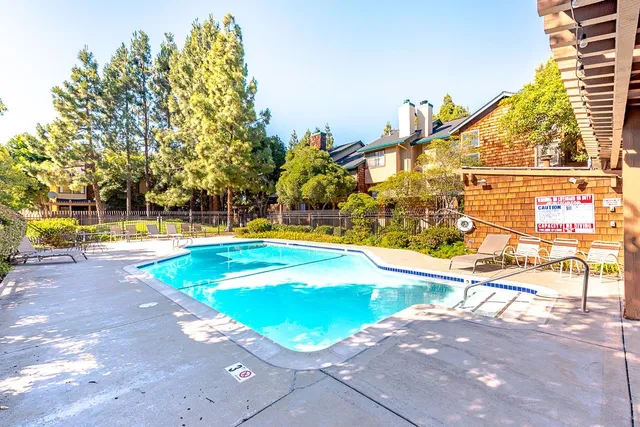 a view of swimming pool with an outdoor space and seating area
